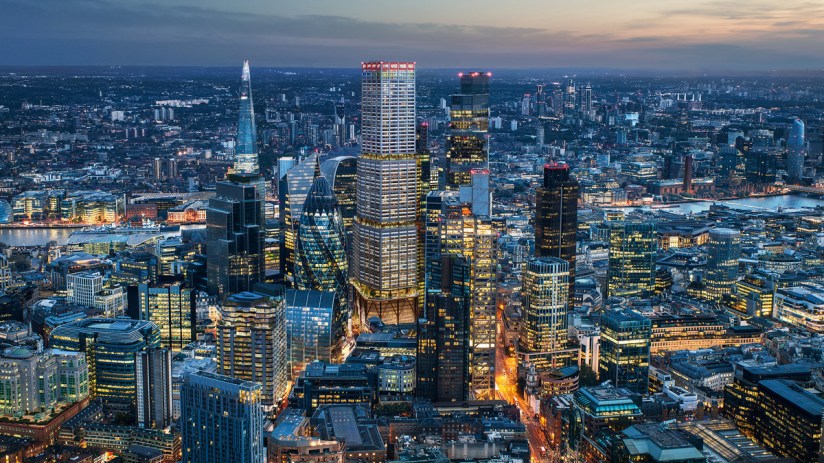 Aerial view of city cluster at dusk showcasing urban landscape and skyline under atmospheric lighting conditions