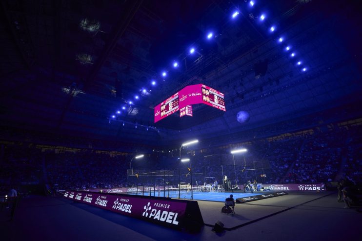 Premier Padel tournament action showcasing players in intense match, highlighting competitive sports environment.