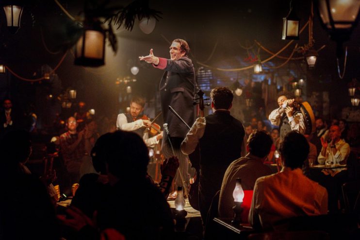 David Alwyn portraying Charles Dickens in The Great Christmas Feast 2025 with festive Victorian attire, credited to Hanson...