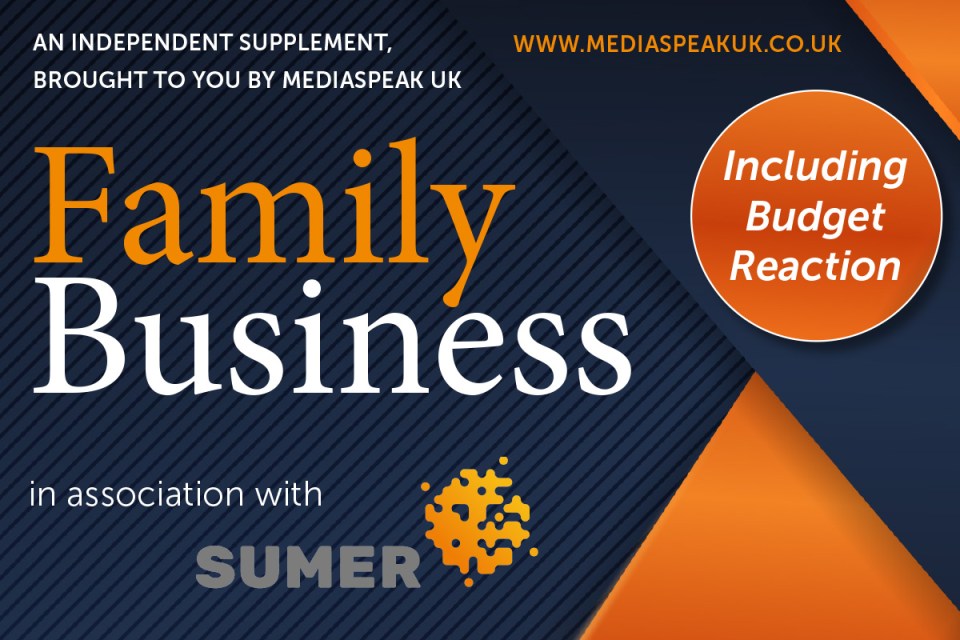 Family business team discussing growth strategies around a conference table in a modern office setting