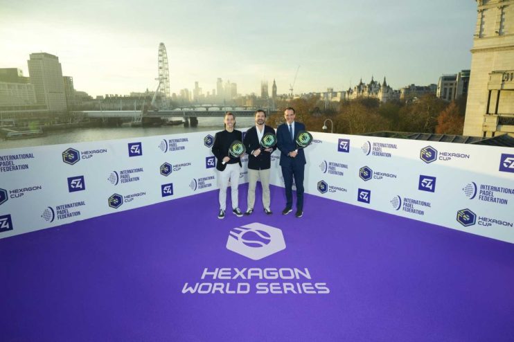 Hexagon World Series event with attendees posing for a photocall on stage, highlighting the gathering of industry leaders.