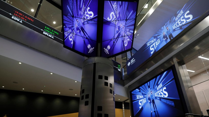 London Stock Exchange building exterior on a busy trading day with bustling city atmosphere and iconic architecture