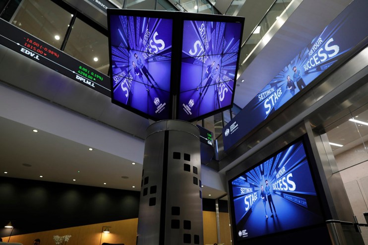 London Stock Exchange building exterior on a busy trading day with bustling city atmosphere and iconic architecture