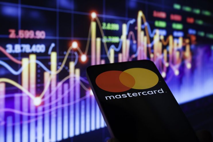 Mastercard logo prominently displayed on a sleek office building, symbolizing global financial services and innovation.