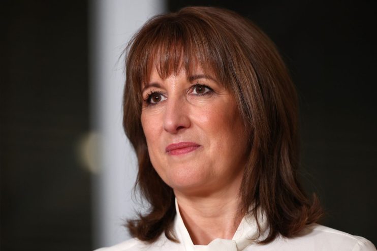 Rachel Reeves delivering a post-budget speech, confidently addressing economic strategies and fiscal policies in a formal ...