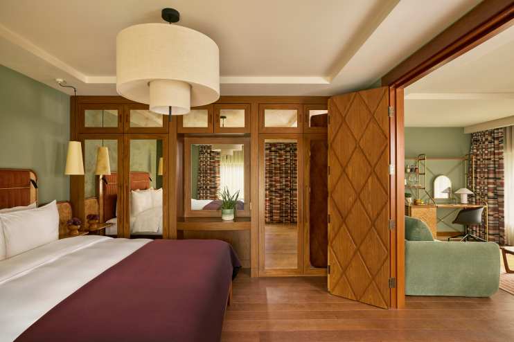 Sir DSQ Sir Devonshire Suite with elegant decor by Martin Morrell, highlighting luxury and sophistication in business sett...