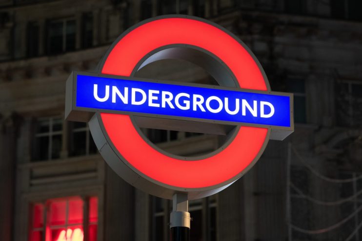 London Underground roundel sign at a station, symbolizing Transport for Londons iconic public transit network