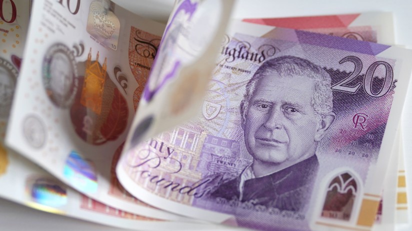 British pound banknotes in various denominations, highlighting UK currency amidst economic discussions