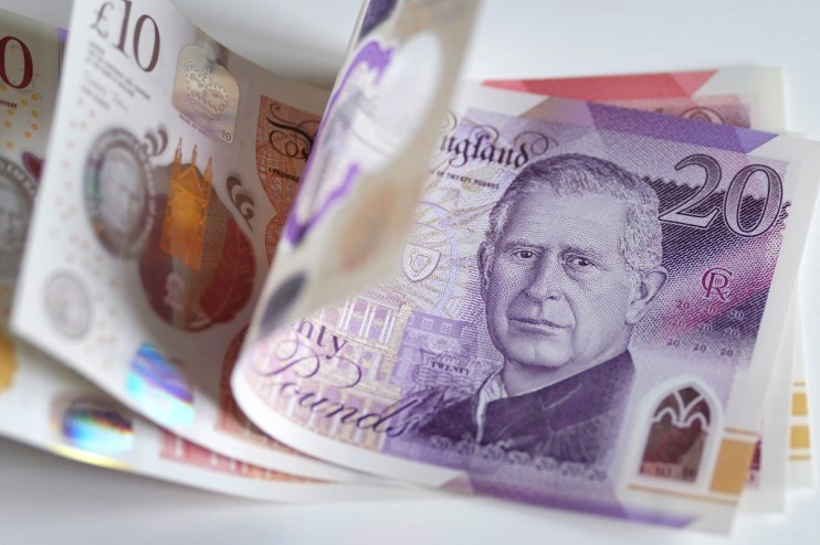 British pound banknotes in various denominations, highlighting UK currency amidst economic discussions
