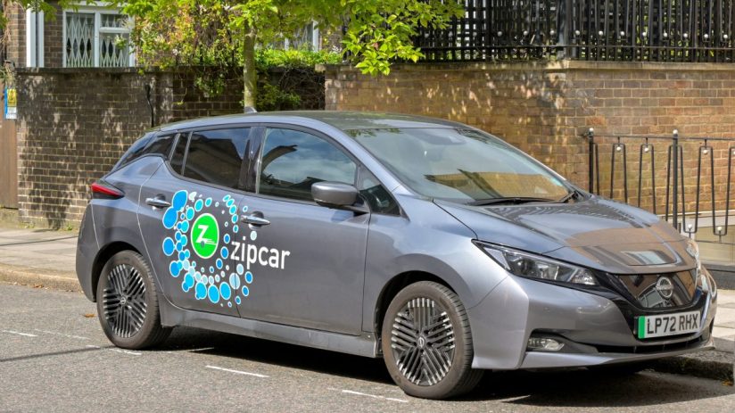 Zipcar vehicle parked in urban setting, highlighting convenient car-sharing service for city commuters and eco-friendly tr...