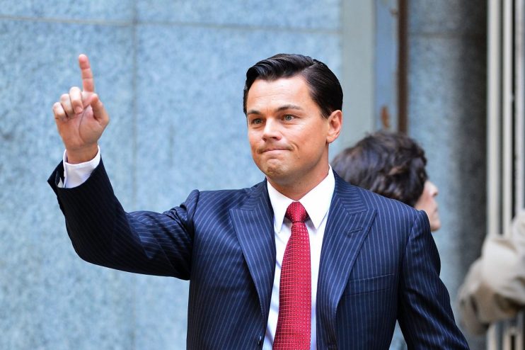 Billionaire inspired by Wolf of Wall Street with stock market charts and luxury office setting, reflecting financial success