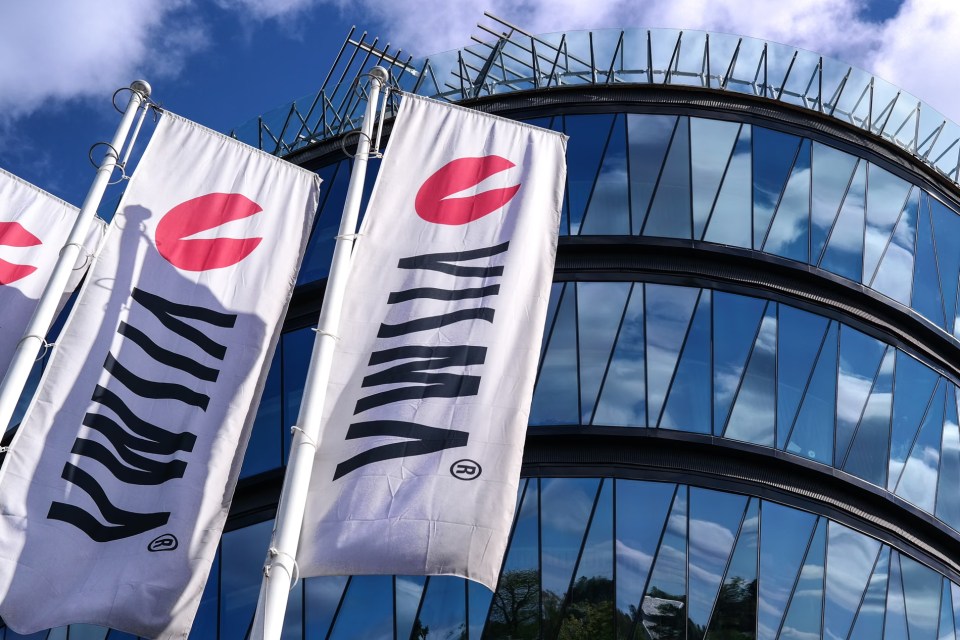 Visma office building exterior with modern architecture and company logo prominently displayed against a clear sky