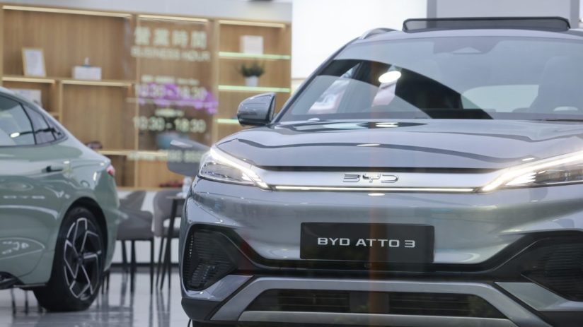 BYD electric vehicle displayed at a Chinese auto show, highlighting Chinas innovation in the EV market.