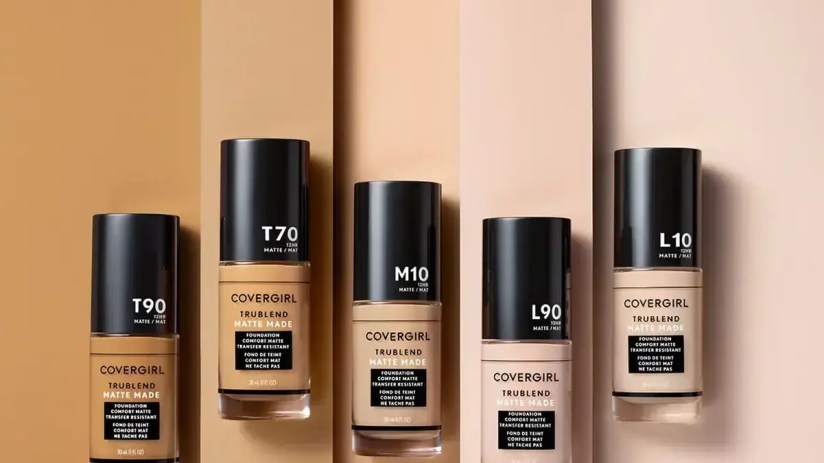 Coty cosmetics products displayed on shelves, showcasing a range of beauty items in a retail setting.