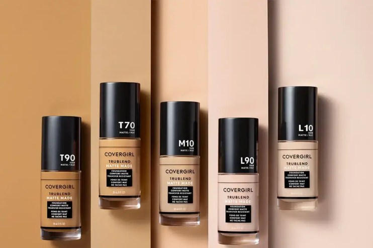 Coty cosmetics products displayed on shelves, showcasing a range of beauty items in a retail setting.
