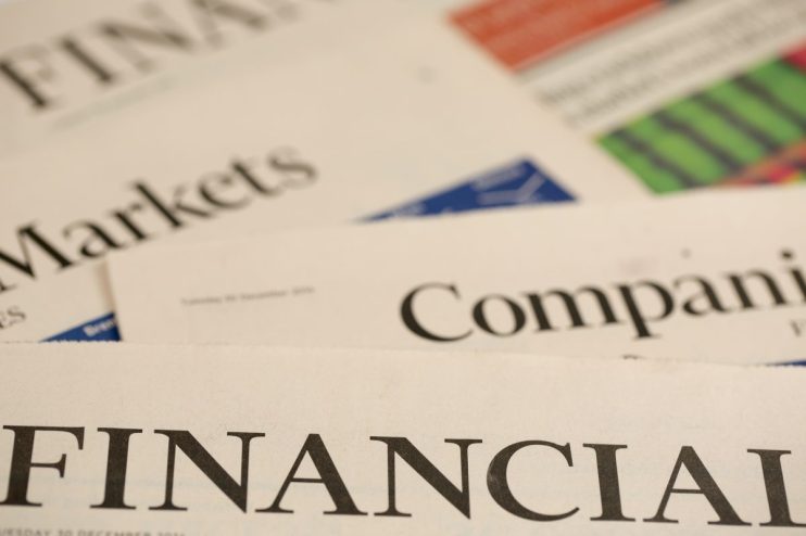 Financial Times newspaper front page featuring top global business and economic headlines in bold typeface