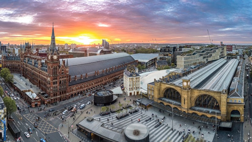 Kings Cross bustling with commuters and travelers, showcasing vibrant city life and iconic architecture in a dynamic urban...