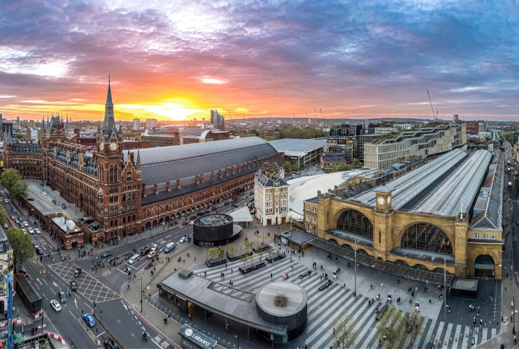 Kings Cross bustling with commuters and travelers, showcasing vibrant city life and iconic architecture in a dynamic urban...