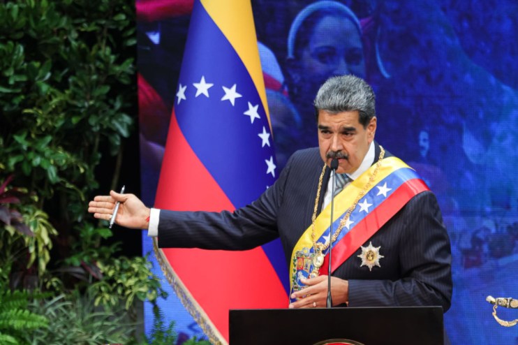 Nicol&aacute;s Maduro speaking at a press conference in Venezuela, discussing political and economic issues in the country.