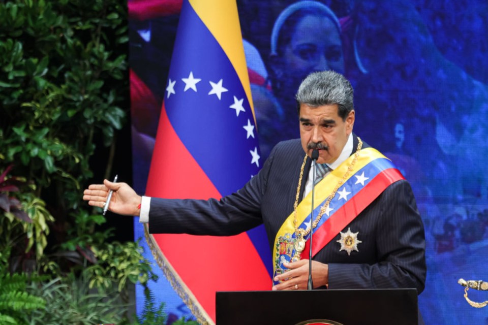 Nicolás Maduro speaking at a press conference in Venezuela, discussing political and economic issues in the country.