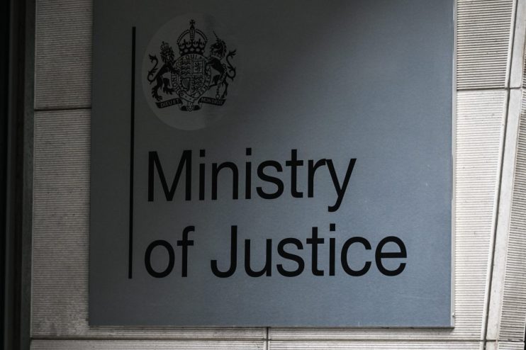 Ministry of Justice building exterior with government signage and clear sky backdrop
