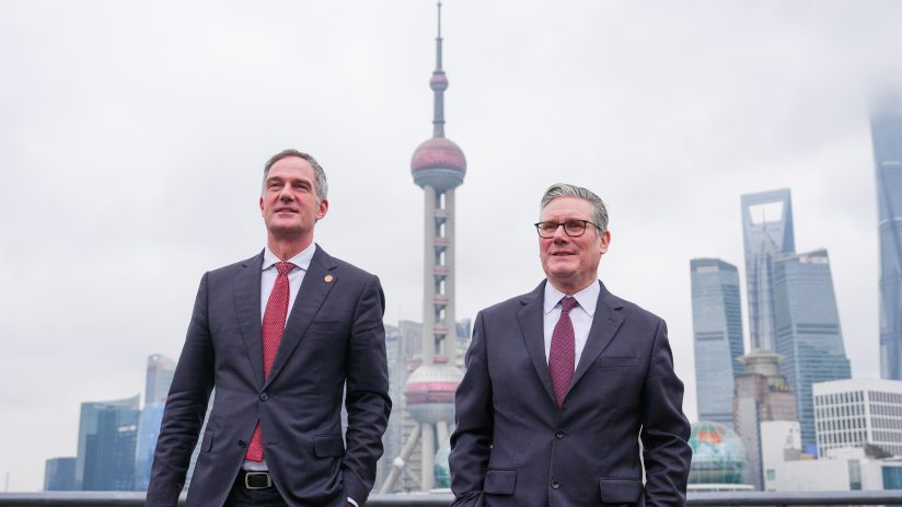 Peter Kyle and Keir Starmer engaged in discussion at a political event, emphasizing leadership and collaboration.