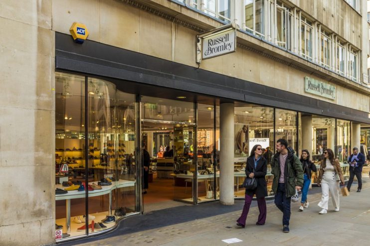 Russell Bromley storefront showcasing luxury footwear and accessories, highlighting elegant window display for fashion ent...