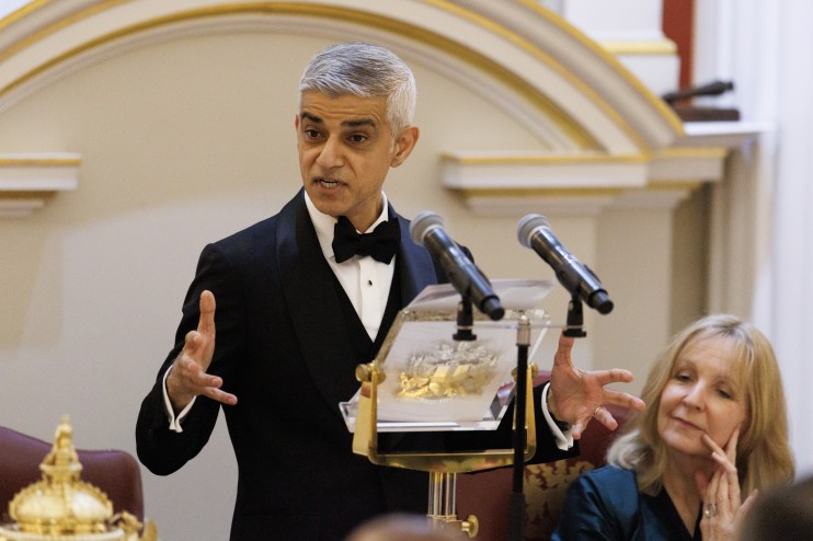 Sadiq Khan speaks at Mansion House unveiling AI taskforce initiative, addressing audience with cityscape backdrop