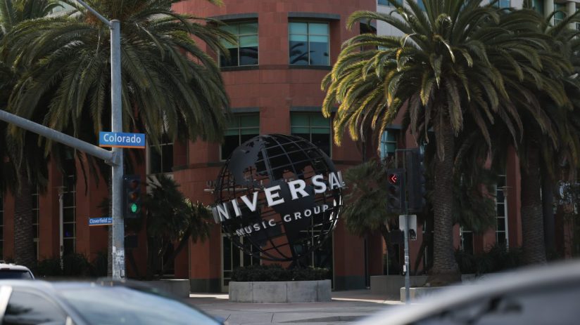 Universal Music Group logo on a sleek building facade in a bustling cityscape, reflecting the companys global influence in...