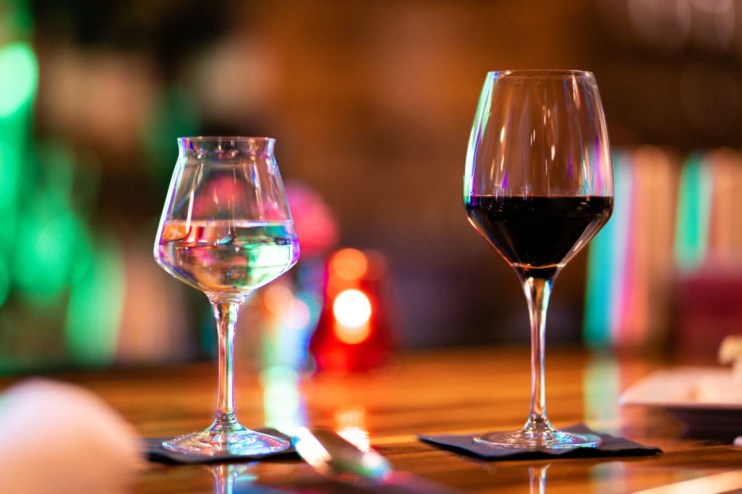 Fine wine collection showcased in elegant glassware, highlighting premium vintage selections in a refined setting.