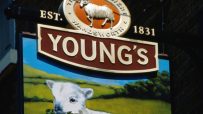 Youngs pub bustling with patrons enjoying drinks, cozy interior, and lively atmosphere in a popular neighborhood setting