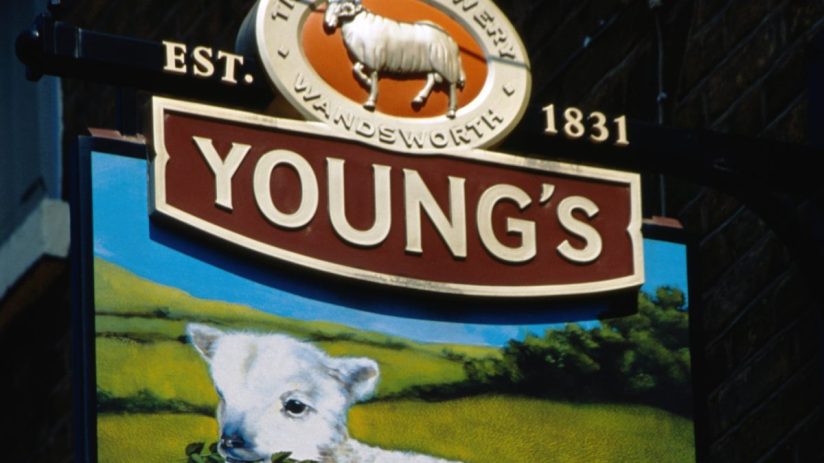 Youngs pub bustling with patrons enjoying drinks, cozy interior, and lively atmosphere in a popular neighborhood setting