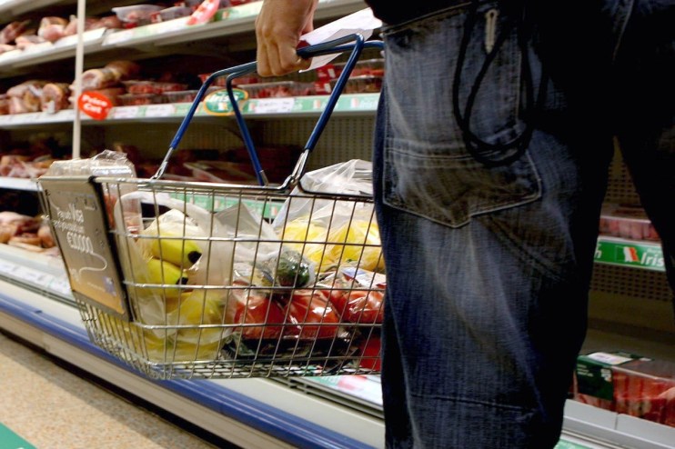 Basket filled with assorted fresh produce and gourmet foods, emphasizing a diverse selection for healthy living