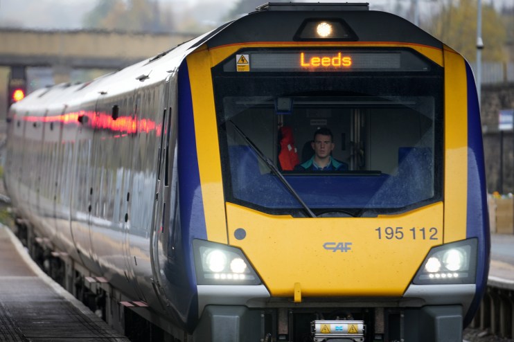 Northern Powerhouse Rail train arriving at Leeds station showcasing modern transportation infrastructure.