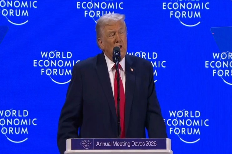 Donald Trump speaking at the World Economic Forum in Davos, addressing global leaders on economic policies and internation...