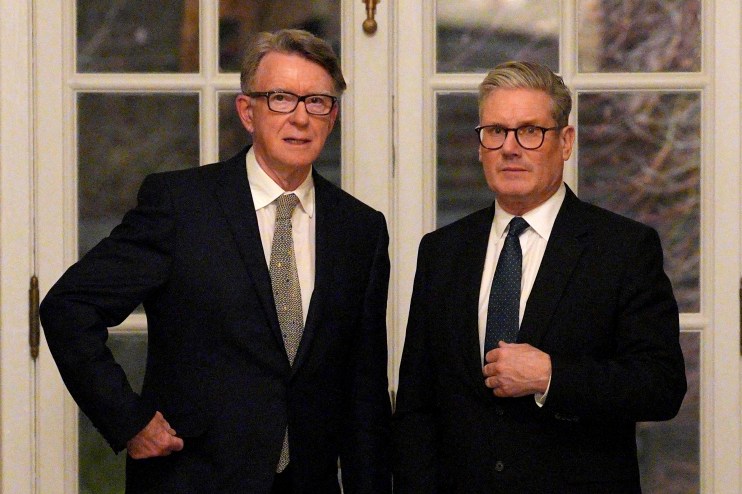 Peter Mandelson and Keir Starmer discussing political strategies at a conference setting with serious expressions.