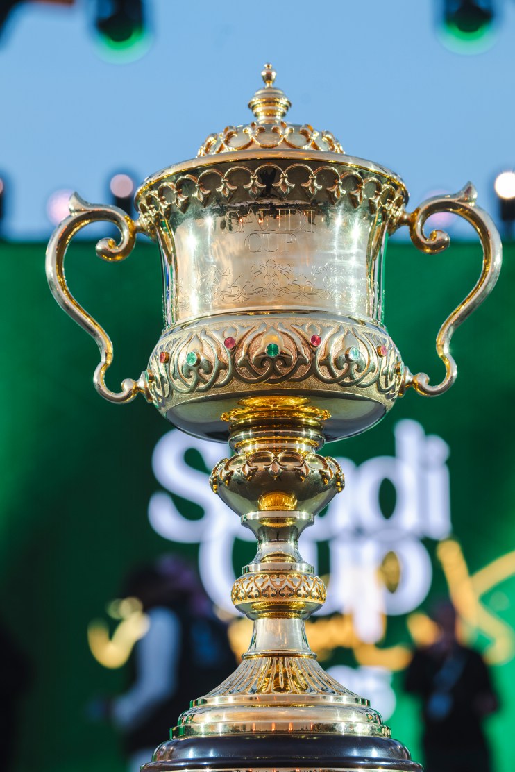 Saudi Cup trophy on display, shining gold with intricate detailing, representing prestigious horse racing event in Riyadh.