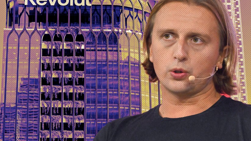 Revolut app interface on smartphone screen showcasing financial transaction features, set against a modern office background.