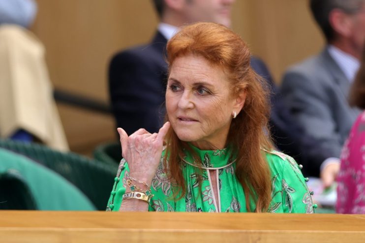 Sarah Ferguson attending a public event, wearing a stylish outfit, engaging with audience, highlighting her public persona