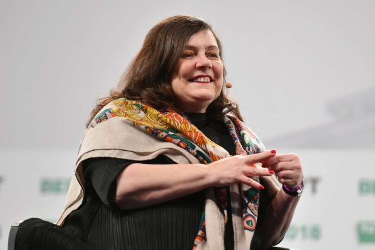 Anne Boden speaking at a business conference, highlighting financial innovations and industry leadership.