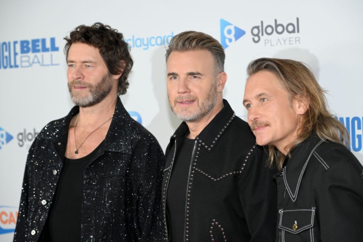 Capital FM Jingle Bell Ball stage featuring vibrant lights and enthusiastic crowd during a festive global radio event.