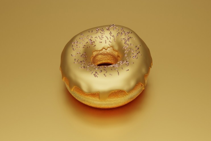 Golden donut on a white plate, symbolizing luxury and indulgence, with a gleaming glaze reflecting ambient light.