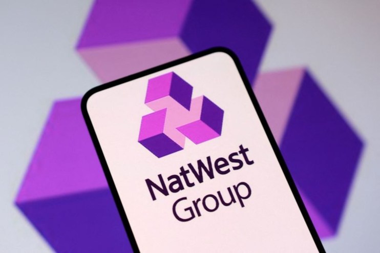 NatWest bank logo prominently displayed on a modern glass building, reflecting the financial institutions corporate identity.