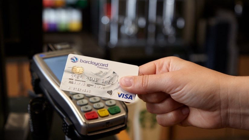Digital payment transaction concept with credit card, smartphone, and currency symbols highlighting modern business financ...