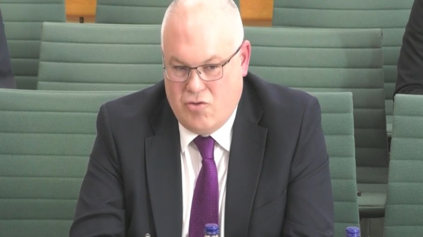 Business leader discussing innovative payment solutions in a boardroom setting, emphasizing strategic financial growth.