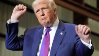 Donald Trump dancing at a campaign rally in Pennsylvania, engaging supporters with enthusiastic gestures and lively expres...