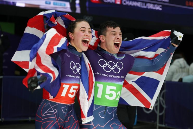 Athletes competing in a snowy Winter Olympics event, showcasing diverse sports and winter gear against a mountain backdrop.