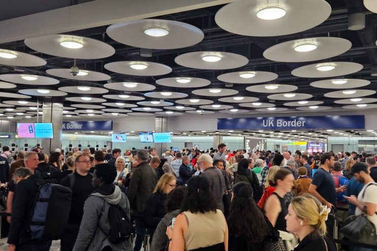 Heathrow Airport bustling with travelers and airplanes on the tarmac, highlighting its role as a major international hub