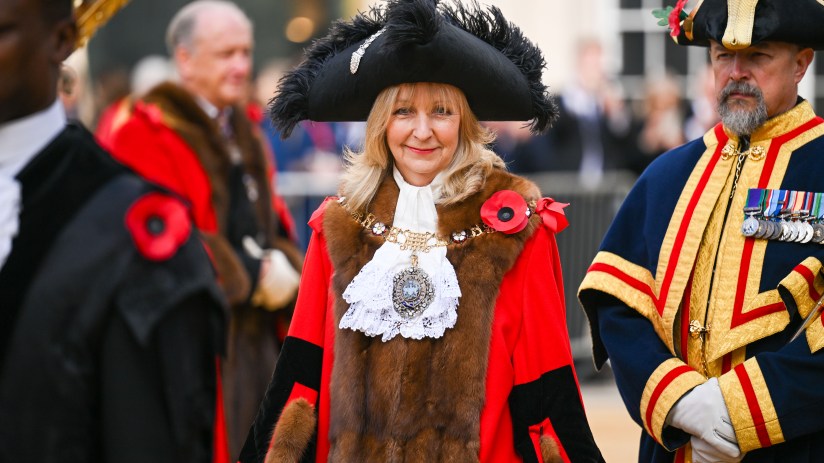 Lady Mayor Susan Langley at Canada event, wearing ceremonial attire, engaging with attendees, showcasing leadership.