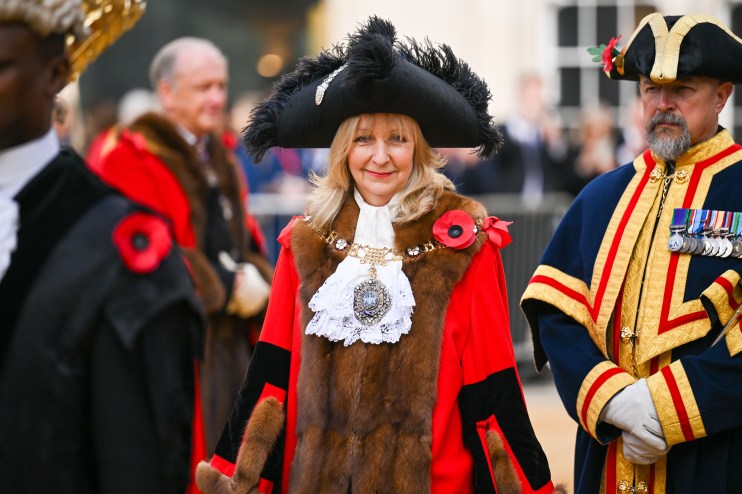 Lady Mayor Susan Langley at Canada event, wearing ceremonial attire, engaging with attendees, showcasing leadership.